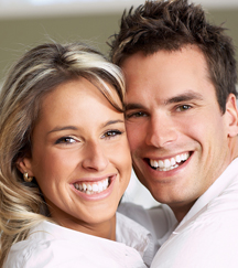 stock photo young couple snuggling together smiling